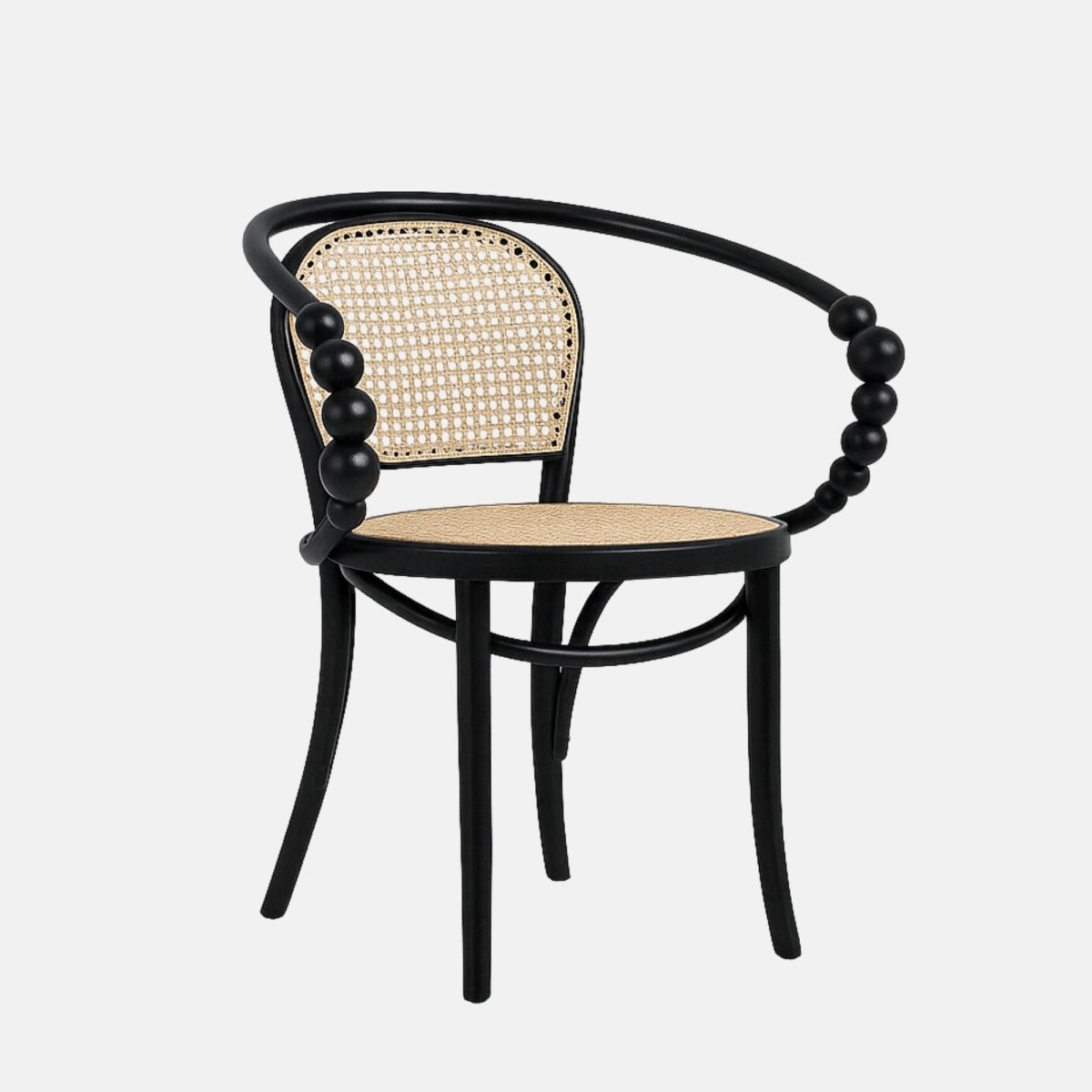 Contemporary armchair with a black wooden frame, curved beaded armrests, and woven cane seat and backrest in natural rattan.
