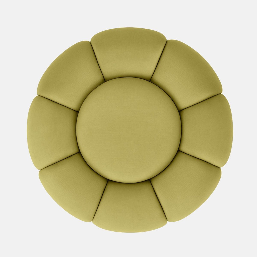 Light green velvet flower-shaped ottoman with petal-style upholstery and dark wood base modern statement footstool or coffee table for living room or hotel lounge.