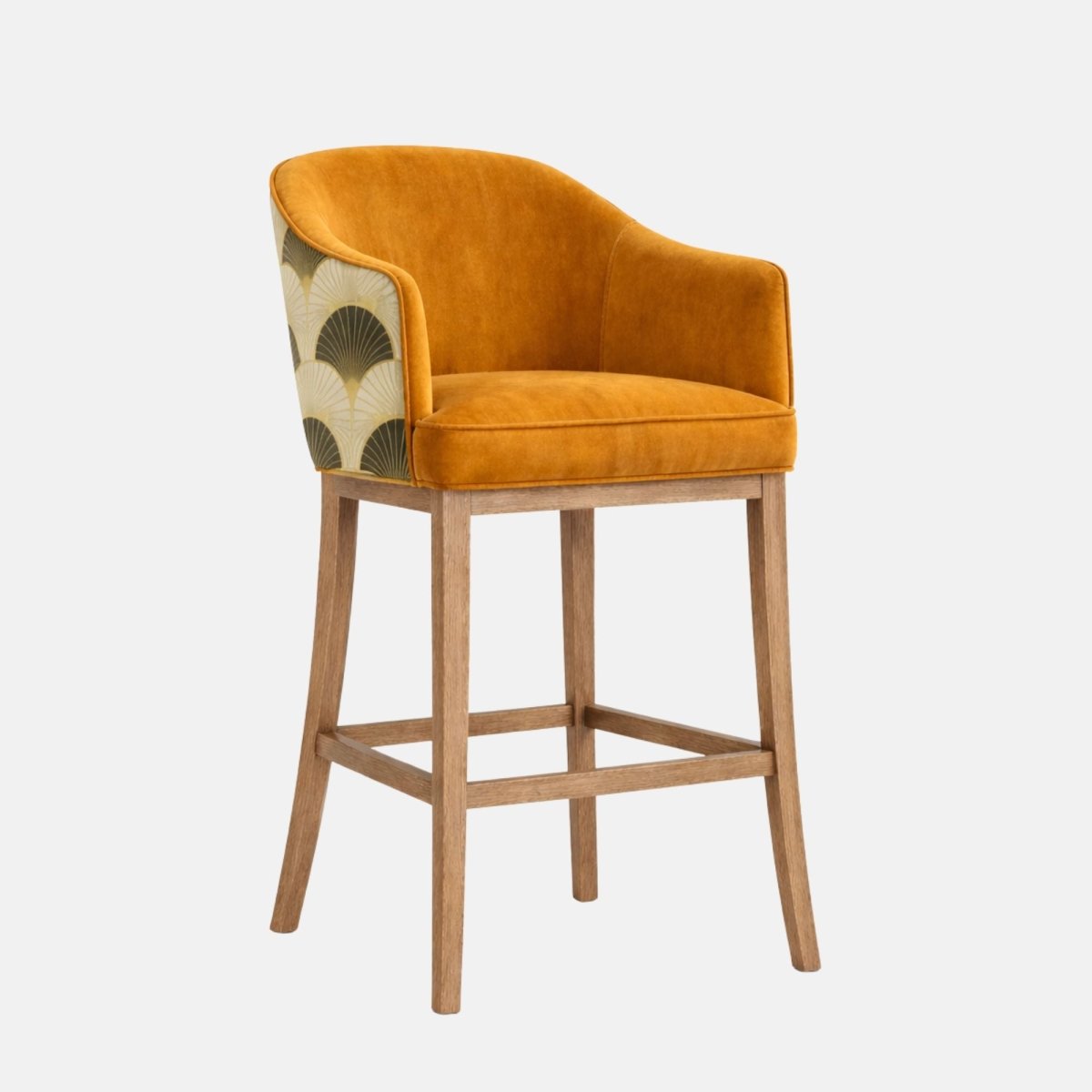 Side profile of a bar-height stool with a navy upholstered seat and curved wraparound back/arms, blue-and-cream patterned fabric on the outer back, and a medium-brown wooden frame with four legs and two horizontal stretchers, photographed on a white background.
