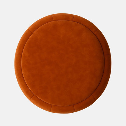 Rust velvet round ottoman with vertical panel upholstery and dark wood base  modern upholstered stool or footrest for living room, bedroom, or hotel lounge.