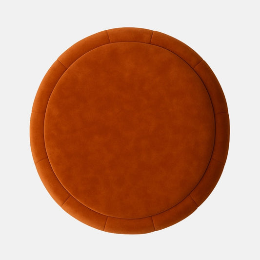 Rust velvet round ottoman with vertical panel upholstery and dark wood base  modern upholstered stool or footrest for living room, bedroom, or hotel lounge.