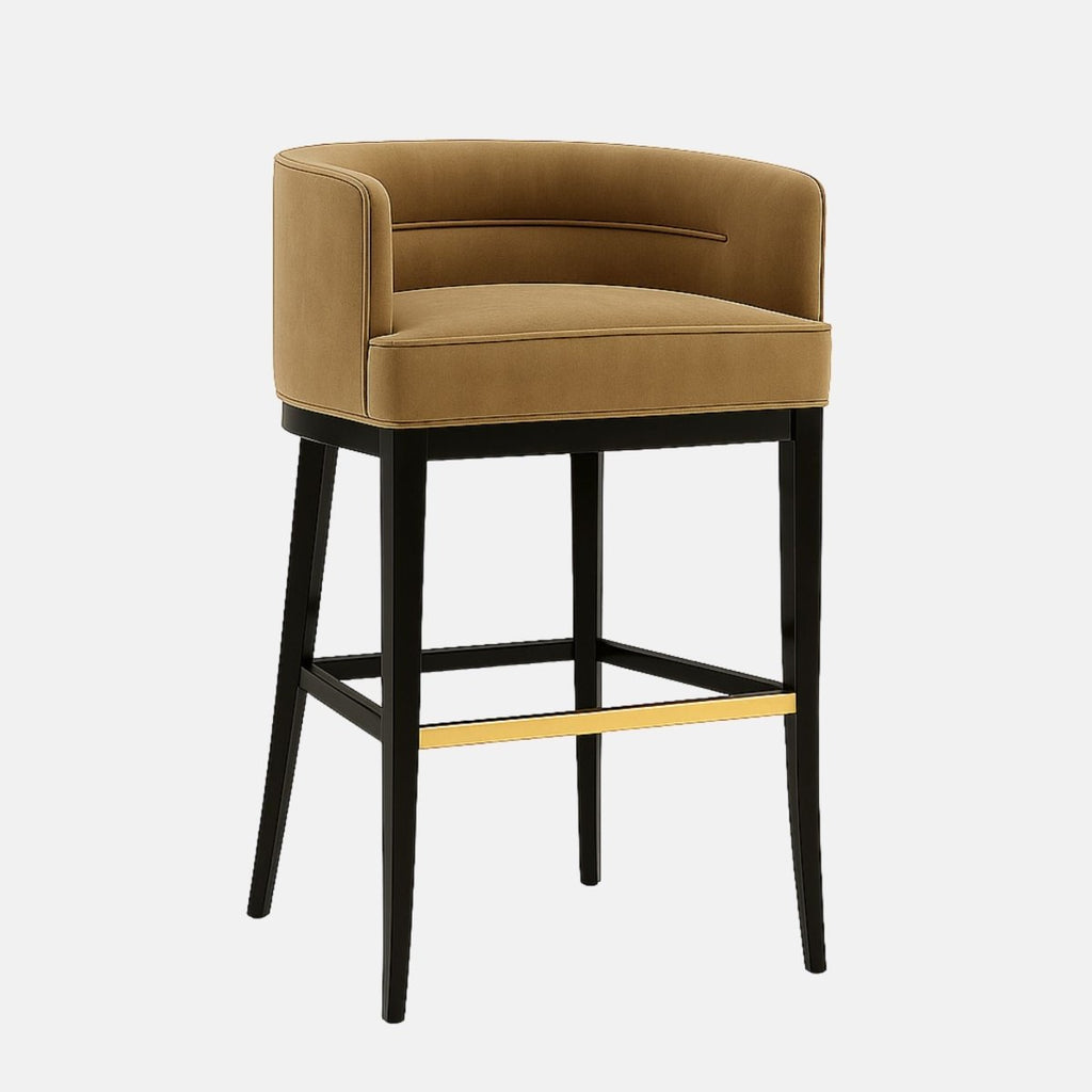 Upholstered bar stool with a curved camel-colored seat, black tapered legs, and a gold metal footrest