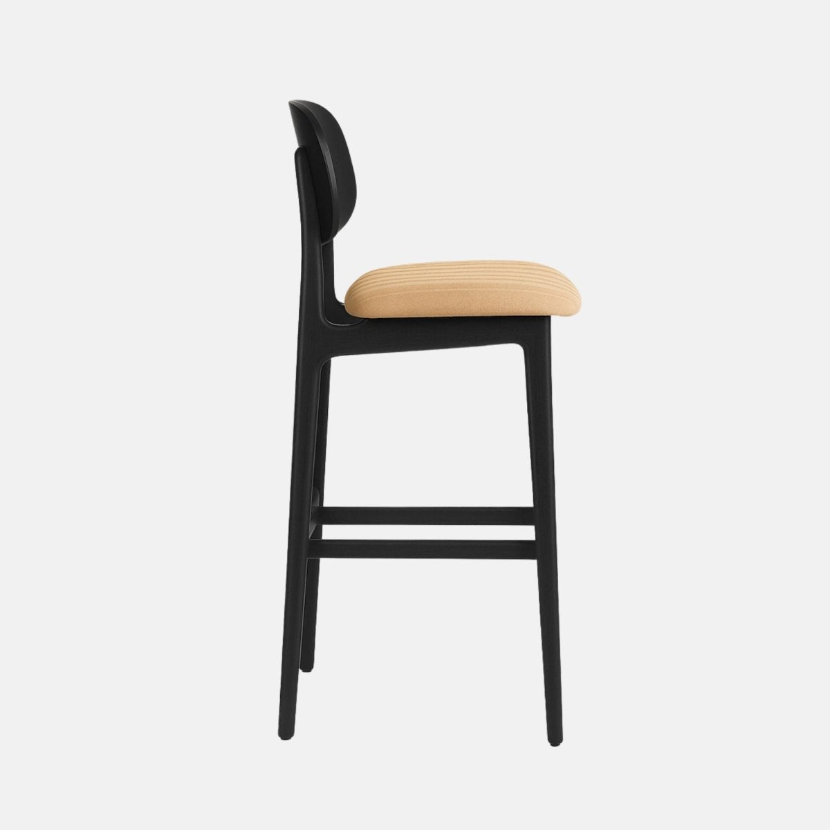A modern black wooden bar stool with a curved backrest and a cushioned beige upholstered seat featuring subtle fluted stitching, supported by four tapered legs with horizontal footrests