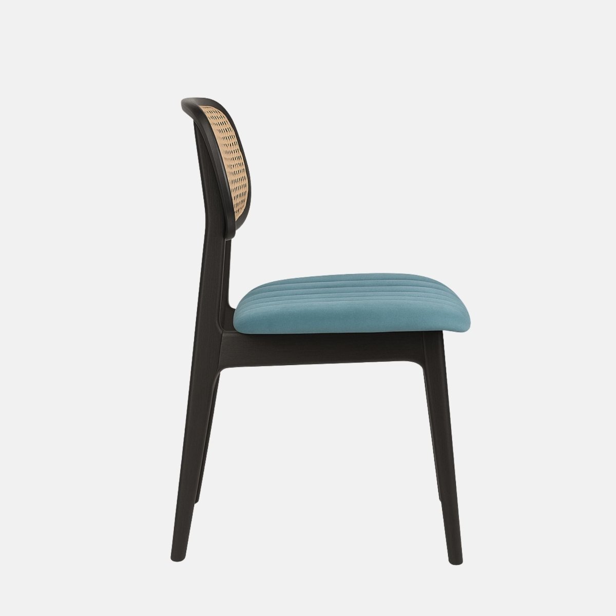 Modern dining chair with black beechwood frame, cream cane netted backrest, and upholstered blue cushioned seat.