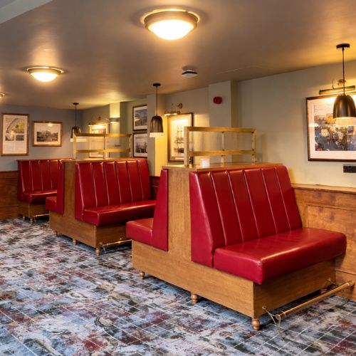 Classic diner restaurant interior with red leather booth seating and vintage decor