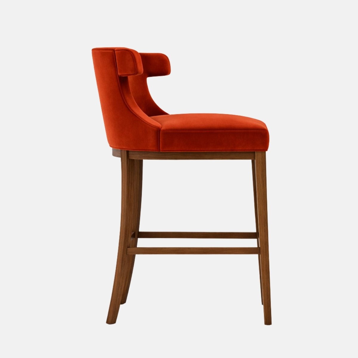 Three-quarter view of a bar-height stool with a curved, wraparound tub back and a thick seat cushion in deep raspberry/burgundy velvet (subtle ribbed texture on the seat), on a light wood four-leg frame with square stretchers, photographed against a white background.