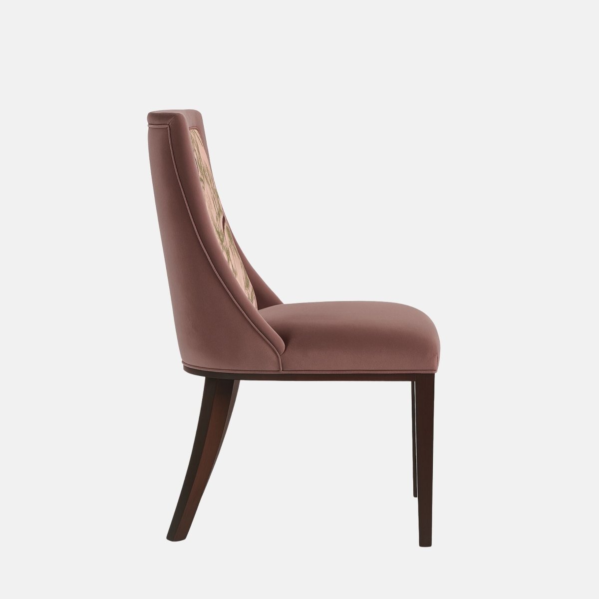Upholstered dining chair in muted mauve fabric with a cushioned seat and angled backrest, featuring a pink botanical and bird-patterned fabric panel, supported by dark wooden legs, shown on a white background