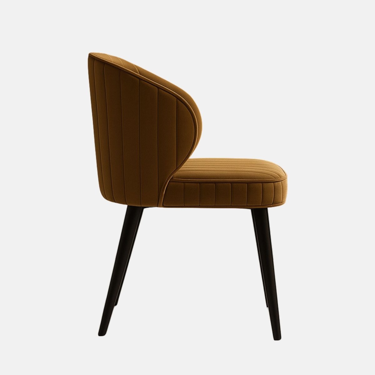 Contemporary accent chair with curved backrest, upholstered in caramel brown velvet with vertical channel tufting, and supported by slim black wooden legs.
