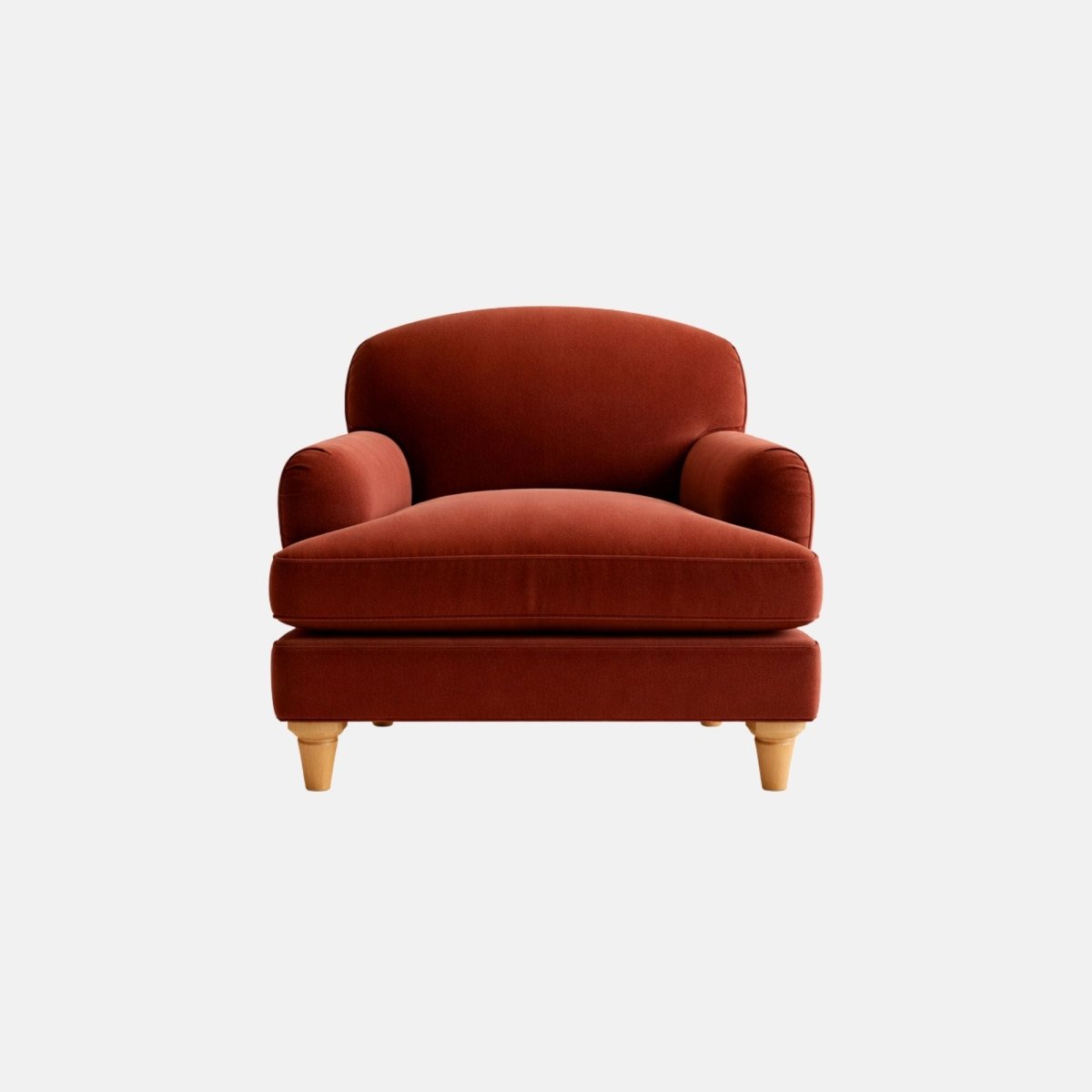 Stylish lounge armchair in rich rust-red upholstery with soft curved back, padded arms, and light wooden legs, suited for modern hospitality and residential interiors