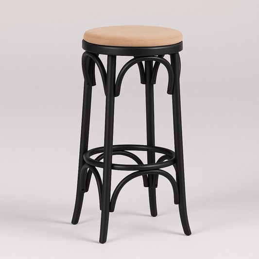 A black wooden bar stool viewed from a bird's eye perspective, featuring a round pastel brown velvet seat cushion and curved leg supports, set against a plain light background with soft natural shadows.