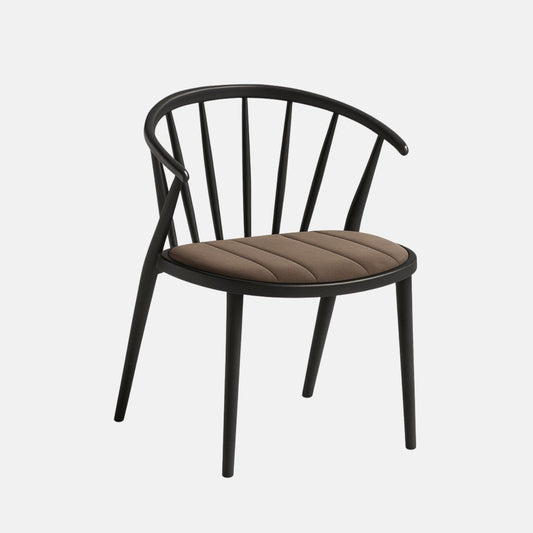 A modern accent chair with a sleek matte black wooden frame, featuring a gently curved backrest supported by slender vertical slats and angled rear legs. The seat is upholstered in light milky chocolate brown velvet with subtle vertical stripe stitching, offering a soft and refined contrast to the bold frame. The design blends contemporary elegance with ergonomic comfort.