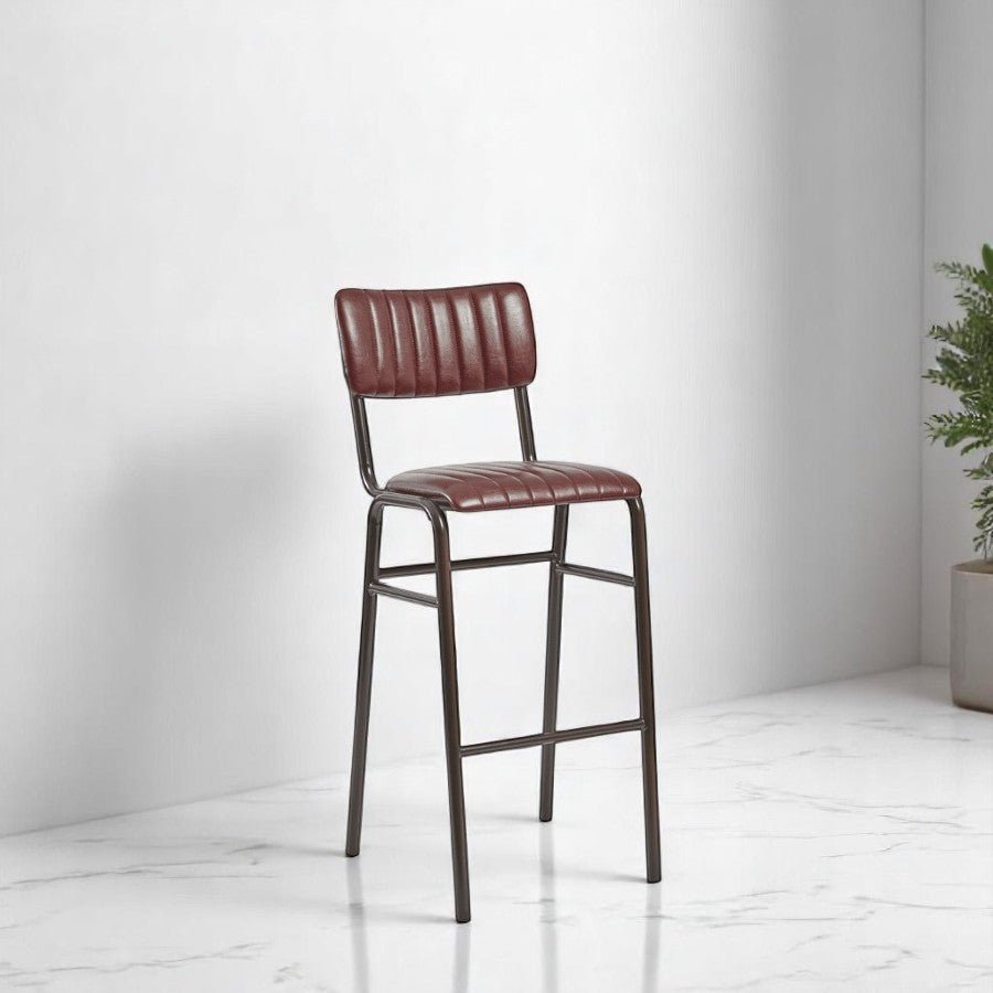 alt="Black leather padded stool with back support on sleek metal frame, stackable design"