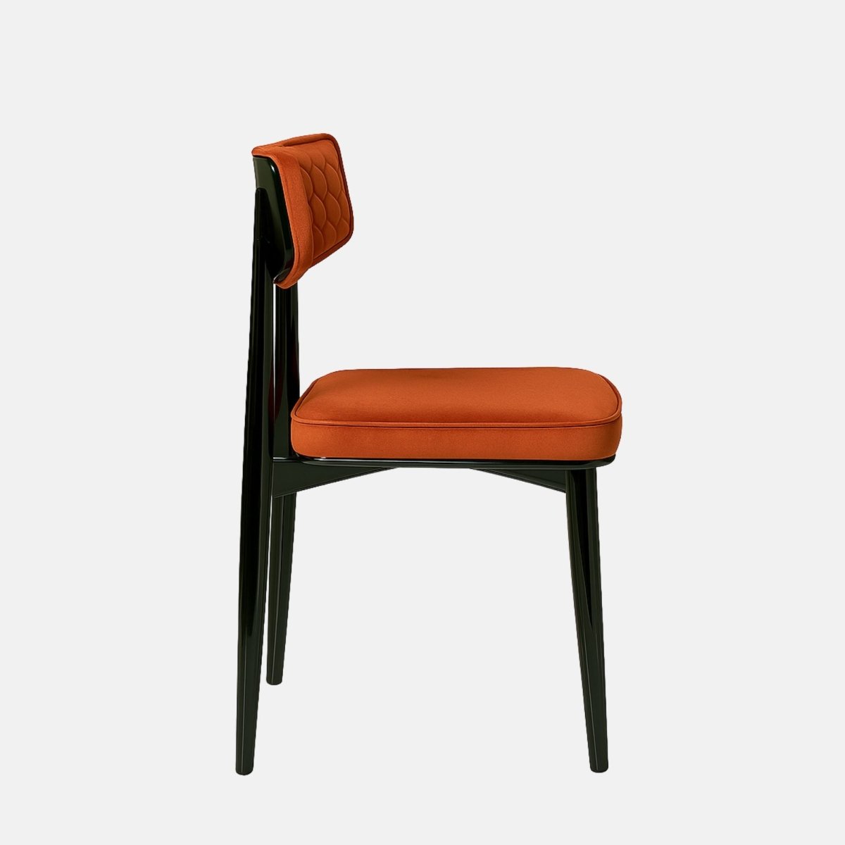 Modern dining chair with a black wooden frame and legs, featuring a burnt orange upholstered seat and a hexagon-patterned backrest, set against a light grey background
