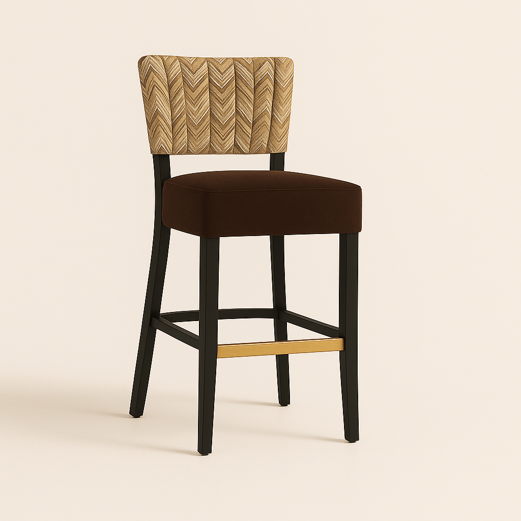 Bar stool with a modern design featuring a cushioned dark brown seat, a chevron-patterned upholstered backrest in beige and brown tones, black wooden legs, and a brass gold footrest, set against a soft, light coloured background.