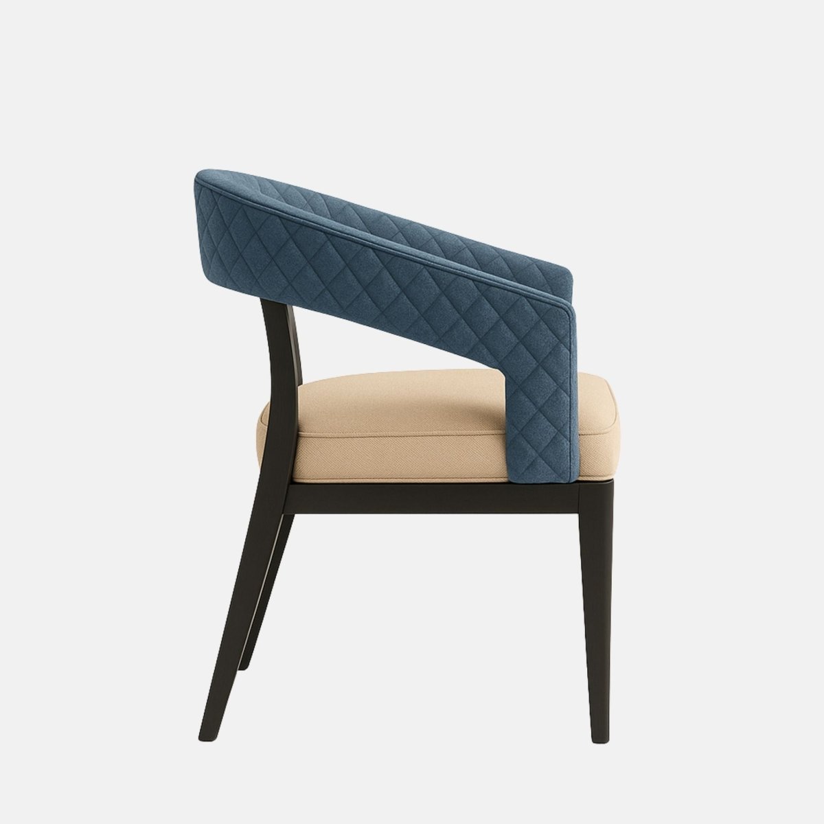 Contemporary armchair with a black wooden frame and tapered legs, featuring a quilted blue velvet curved backrest and a contrasting beige upholstered seat cushion, set against a light grey background