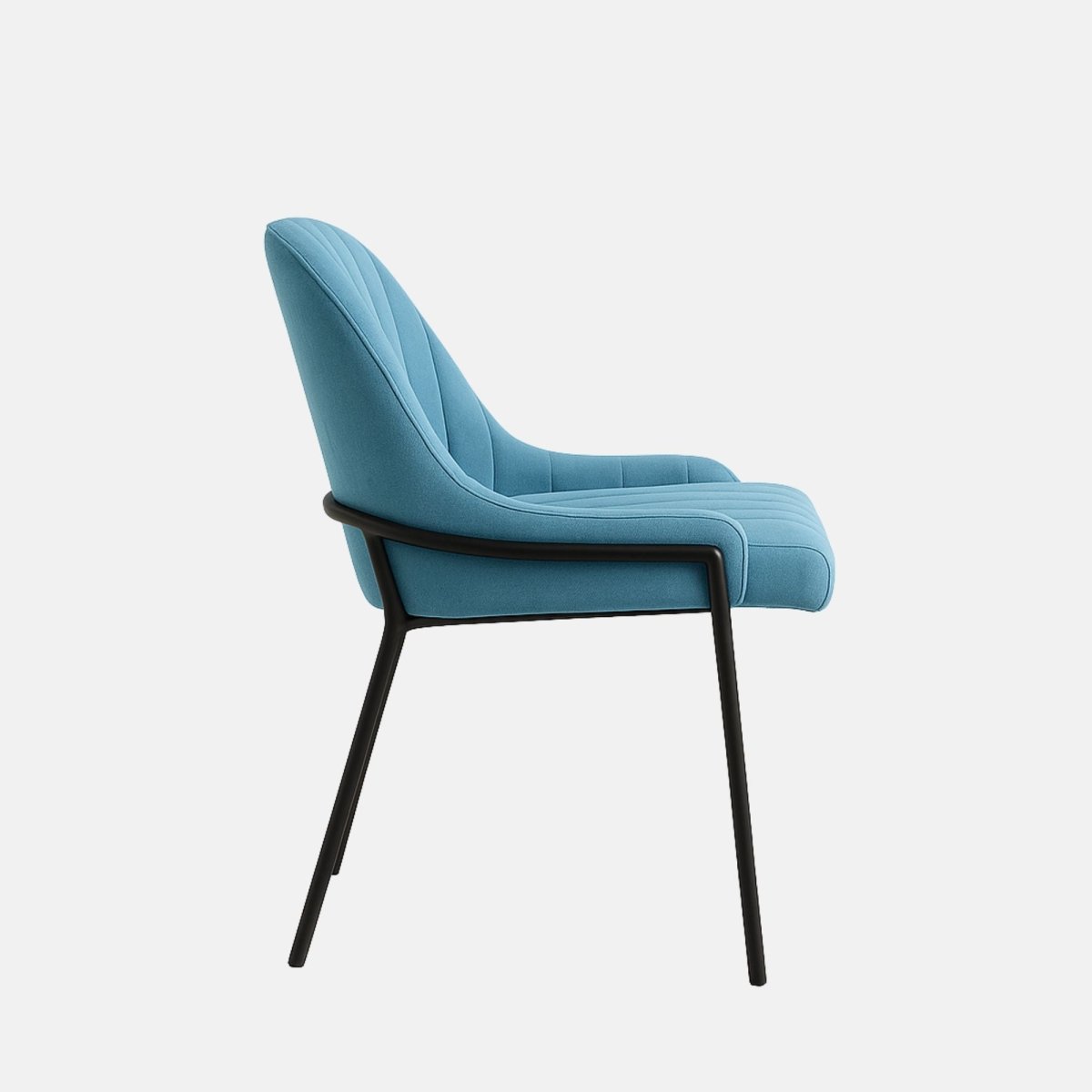 Modern upholstered dining chair in light blue velvet with vertical channel tufting, curved backrest, and slim black metal legs.